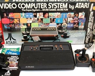 Vintage Atari 2600 with Joy Sticks, Paddles, and Combat Game
