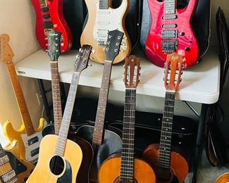 30 guitars, cello. Just come and buy one. Many of these are autographed, but I have not gotten that far yet to figure out who autographed them.