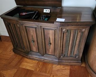 Sylvania Console Stereo with8 track - radio and speakers work. We don't kno