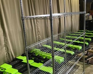 "METRO" STYLE METAL RACK WITH ESCAPE STEPUP DECKS IN BACKGROUND