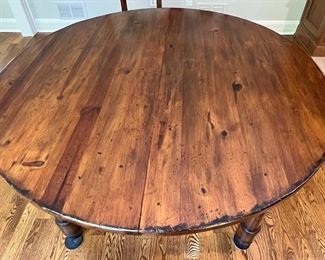 49. Round Dining Table w/ Distressed Finish 2-15" leaves and Protective Pads (56" x 56" x 31"))