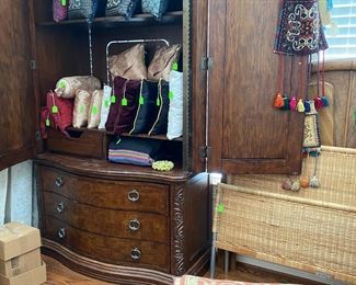 Large Armoire loaded with silk pillows,  area rug
