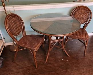 Glass top wicker/rattan table 30 x 36 diameter and 2 chairs