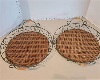 Two round wicker and wire serving trays