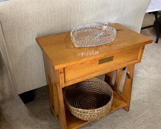 this little side table (that doubles as a seat) has a hinged top for storing things such as remotes and coasters away!