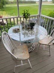 Antique chairs and glass table