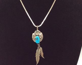 Sterling Silver Feather Style Pendant with Turquoise Colored Stone