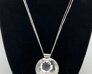 Sterling Silver Circle Hammered Pendant on a Sterling Silver Chain