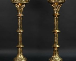          3	Pair of Brass Altar Sticks	Pair of brass altar sticks. Each 19"H. Tarnishing, pitting and losses to brass patina, spikes to hold candles missing.
