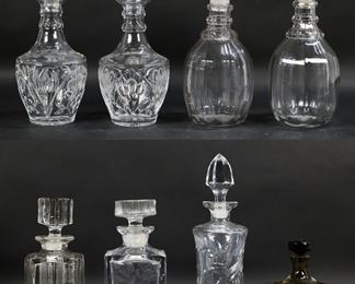          6	8 Glass Decanters	8 decanters, including 2 pairs, crystal, vintage Rye decanters. Larger pair each 12 1/8"H including stoppers. Chips to stopper and interior end of stopper on Rye decanter, chips to stopper on square decanter.
