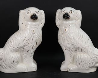         23	Pair of Staffordshire Porcelain Dogs	Pair of Staffordshire porcelain dogs. Each 14 5/8"H x 10 1/2"W. Both drilled, both with losses to painted decoration.
