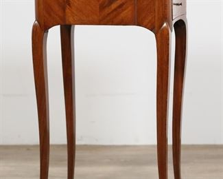         50	Louis XV Style Reading and Writing Stand	"Louis XV style reading and writing stand. 19th century. Cabriole legs with brass mounts, side drawer for documents, two ink drawers, center drawer containing fold-out stand. Wear, scratches, marks, and split to wood of top. Losses and cracking to wood and veneer on front of stand. Small splits to wood throughout sides of stand. Later fold-out support for center drawer, portion of original support is included.

16 5/8"" W x 11 3/4"" D x 29"" H.

From the collection of a prominent Connecticut family."
