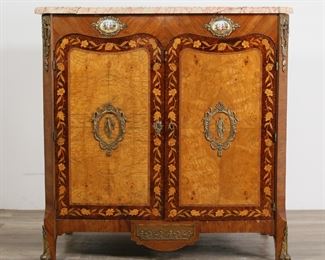         52	Louis XV Style Marble Top Server Cabinet	"Louis XV style marble top server cabinet. French, 20th century. Marble top, porcelain and brass mounts, marquetry inlaid doors. Key is included. ""MADE IN FRANCE"" stamped on underside of marble and labeled on server. Cracks, losses, and repairs to marble top. Separation of brass mount from right foot of server. Chips and losses to wood and veneer on bottom edge of left side, front of apron and corner of right door. Escutcheon from right door detached but present. Scratches and wear to shelves and interior of server.

41"" W x 21"" D x 41 3/8"" H."
