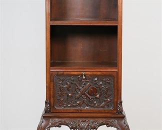         57	Chippendale Style Bookcase	"Chippendale style bookcase. 20th century. One shelf, drop front door with carved front, cabriole legs with scroll feet. Nicks and scuffs to wood left and right sides of bookcase. One panel on back is hinged but nailed in. Scuffs and nicks to feet. 

22 1/2"" W x 14 1/8"" D x 68"" H. 37 lbs."
