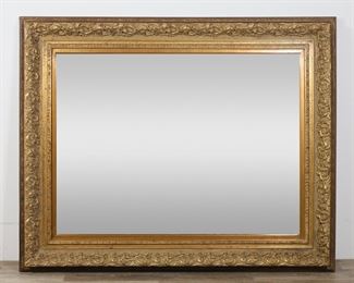         58	Monumental Rococo Style Hall Mirror	"Monumental Rococo style hall mirror. 20th century. Large foliate and scroll composition gilded frame, beveled mirror. Staining and discoloration to inner edges of frame. Small chips, stains and wear to wood throughout outer edges of frame.

49 5/8"" x 61 1/2""

From the collection of a prominent Connecticut family."
