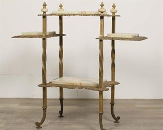         61	Victorian Marble and Brass Tiered Plant Stand	"Victorian marble and brass tiered plant stand. Late 19th century. Four marble topped tiers, marble and brass finials, spiral form legs.""777"" stamped into brass on underside of lower tier. Some wear, tarnishing, and rusting to brass throughout stand. Scratches and wear to marble tops. Chips and losses to marble on edges. Small splits and separations to brass on spiral legs.

32 1/2"" W x 14 1/2"" D x 31 1/2"" H."
