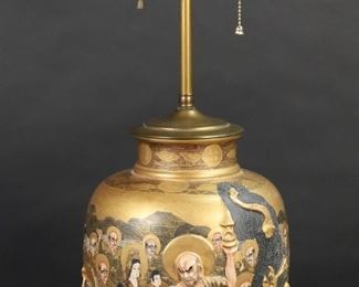         66	Satsuma 1000 Faces Porcelain Lamp	Satsuma Japanese porcelain 1000 Faces lamp. 33"H including base, lamp fittings and finial. Crazing throughout, minor losses to gilt decoration and losses to gilt decoration on finial.
