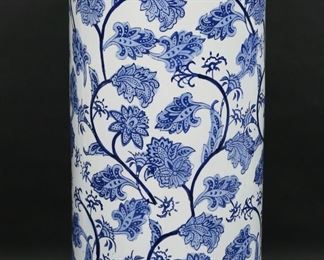         76	Chinese Style Blue and White Umbrella Stand	"Chinese style blue and white umbrella stand. 20th century. Porcelain decorated with floral motifs. Unmarked. Light scuffs and wear to surface. Dimples to porcelain on edge of top. 

23 3/4"" H x 8 3/4"" diameter of top. 13 lbs."
