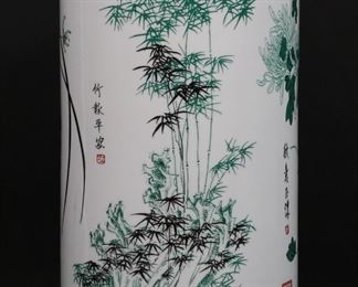         77	Chinese Porcelain Umbrella Stand	Chinese porcelain umbrella stand, decoration of cherry blossoms, bamboo and flowers. 18 3/8"H. Minor losses to decoration around rim.
