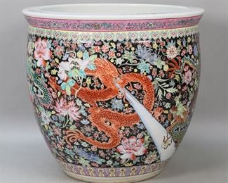         81	Chinese Famille Noir Fishbowl	"Chinese famille noir fishbowl. 20th century. Fishbowl with decorated rim, body adorned with dragon and flowers. ""MADE IN CHINA"" sticker on underside of fishbowl. Light scuffs and staining to top of rim. 

14 1/4"" H x 15 3/4"" diameter of top. 25 lbs."
