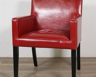        111	Art Deco Style Red Synthetic Leather Armchair	"Art Deco style armchair. 21st century. Produced by Euromarket Designs Inc. Armchair in red polyurethane (synthetic leather) on tapered legs. Euromarket label on underside of chair. Wear, scratches, cracks, and wrinkling throughout polyurethane of arms and seat of chair. Scuff to back of chair. Nicks and scuffs to wood of chair legs. 

25"" W  24"" D x 34 1/4"" H. Seat height 20"", arm height 25 1/2"". 27 lbs."


