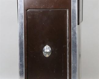        112	Art Deco Smoking Stand	"Art Deco smoking stand. 20th century. Chrome and metal with handle, removable ashtray with lid,  two fold-out extensions,  and front door revealing storage space with one shelf. Wear, tarnishing, scuffs, and scratches throughout chrome and metal . 

10 1/4"" W x 9 3/4"" D x 21"" H. 23 3/8"" W with both leaves folded out. 14 lbs."
