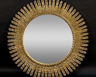       113	Hollywood Regency Style Sunburst Mirror	"Hollywood Regency Style sunburst mirror. 20th century. Gilded composite frame. Losses to gilding on inner edge of mirror. Light scuffs and wear to mirrored surface.

20 3/4"" diameter. 8 lbs."

