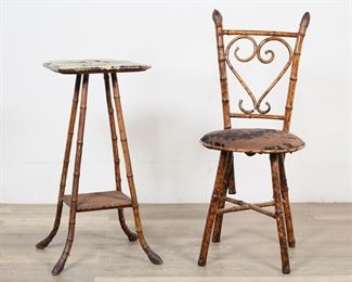        118	Aesthetic Movement Bamboo Chair and Plant Stand	"Aesthetic Movement bamboo chair and plant stand. Late 19th century. Chair with bentwood bamboo frame, splats, and cowhide upholstery. Stand covered in Victorian paper on top with woven lower tier. Scuffs and nicks to bamboo on legs of plant stand. Tears, tattering and losses to paper on top of plant stand.  Splits to bamboo on legs of chair, with later hardware for reinforcement. Separation and break to bamboo on bentwood splat of chair. Staining, wear, and deterioration to leather of upholstery and cushioning. 

Plant stand: 16 1/4"" W x 14 3/8"" D x  28 3/8"" H. Chair: 15 3/8"" W x 17"" D x 36 1/4"" H. Stand and chair weigh 12 lbs. total."
