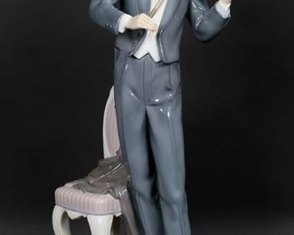        126	Lladro Porcelain Figurine Violin Sonata	Lladro porcelain figurine 01804, Violin Sonata. On wooden base, with certificate. Blue Lladro mark and artist signed Marco A. Nogueron and Pilar Perez on the underside. Number 38 from the limited edition of 3000. Figurine 14 3/4"H not including base.
