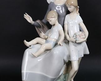        133	Lladro Porcelain Figure Group Mother	Lladro porcelain figure group 4864, Mother. Blue Lladro mark to the underside. 14 1/4"H x 9 1/2"W.

