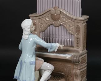        137	Lladro Porcelain Figure Young Bach	Lladro porcelain figure 1801, Young Bach. With blue Lladro mark and artist signed Juan Coderch and Julio Ruiz on the underside. Number 1776 from the limited edition of 2500, with certificate. 11 1/8"H x 7"L.
