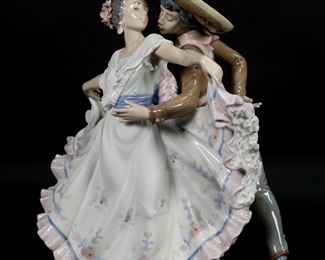        147	Lladro Porcelain Figure Group Mexican Dancers	Lladro porcelain figure group 5415, Mexican Dancers. Blue Lladro mark to the underside. 11 3/4"H. One flower petal missing from hair.

