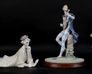        155	3 Lladro Porcelain Figurines Clowns	3 Lladro porcelain clown figurines. Serenading Colombina 6322, 10 1/4"H; Charmingness 4848, 10"H not including wooden base; Clown With Ball 4618, 14 1/4"L. All with blue Lladro marks to the undersides.
