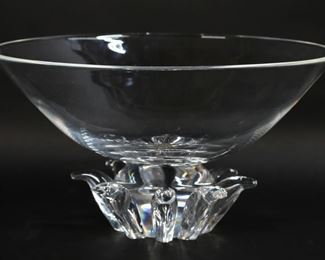        172	Steuben Peony Art Glass Center Bowl	Steuben Peony crystal pedestal center bowl. Signed Steuben on the underside. 6 7/8"H x 12 1/2"-diameter. Scratches and shelf wear to the underside,
