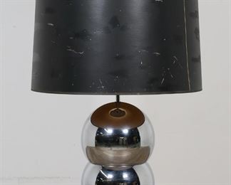        182	George Kovacs Style Modern Stacking Ball Lamp	George Kovacs style mid-century modern chrome stacking ball lamp. Unsigned. 34 1/2"H including harp and finial. Scratches and minor losses to chrome, tears and losses to paper drum shade.
