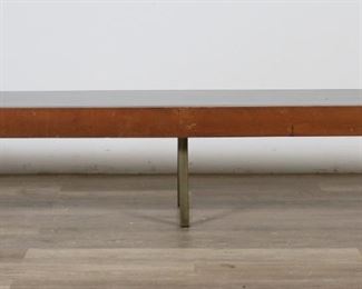        192	Florence Knoll Style Mid Century Modern Hall Bench	"Mid Century Modern hall bench in the style of Florence Knoll (Saginaw, MI, 1917-2019). 20th century. Wooden bench with inset black laminate top resting on six removable metal legs. Scuffs, scratches, and wear throughout laminate. Gouges, scratches, and chips to wood throughout length of bench. Tarnishing, oxidization, and wear to metal of legs. 

96"" W x 16 5/8"" D x 14 5/8"" H. 51 lbs."
