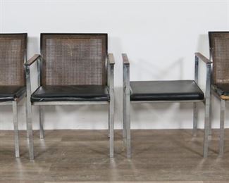        193	Six Lane Mid Century Modern Dining Chairs	"Six Mid Century Modern dining chairs in the style of Milo Baughman (Goodland, KS, 1923-2003). Produced by the Lane Furniture company. Alta Vista, VA, 20th century. Two arm chairs and four side chairs each with black leather seats, caned backs, and chrome legs and stretcher. Lane furniture tag on underside of seat on one chair. Tarnishing and wear throughout chrome of all chairs. Scratches, wear, bending, and tears to caned backs of all chairs. Caned back of one chair is completely torn on right side. Chair back is missing from one armchair. Chair back of second armchair is almost completely separated from arms and frame and is held by one screw. Chip to wood on lower right corner of separated frame (piece is present.) Tears to leather on corners and edges on seats of four chairs. Tears to fabric on undersides of seats of all chairs. Chips and scratches to wood on arms of armchairs. 

Side chair: 18 1/2"" W x 21 1/4"" D x 31"" H. Arm