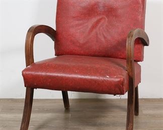        190	Mid Century Chair in the Style of Kem Weber	"Mid Century Modern armchair in the style of Kem Weber (German-American, 1889-1963). Curving wooden arms and legs with red vinyl seat and back. No maker's marks or labels present.  As is, with wrinkling, wear, staining, scuffs, and depressions to vinyl and cushioning of chair. Large tattered hole to back of chair. Tears to cover on underside of seat. Scratches, stains, white paint, water damage and chips to wood on arms and legs of chair.

24"" W x 26"" D x 31 5/8"" H. 18 lbs."

