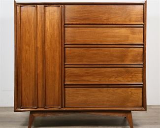        198	Danish Modern Style Dresser Attributed to Lane	"Danish Modern style dresser attributed to the Lane Furniture company. 20th century. Walnut, tapered dowel legs, door concealing five drawers. A valet tray marked ""MISSION CRAFTED IN CALIF."" with crown symbol is provided with chest of drawers. ""SELBY NEW YORK"" marked on drawer slide. No other apparent maker's marks or labels on chest. Light scratches and wear to top of chest. Nicks, and scuffs to wood left and right sides of chest. Scuffs and chips to wood on feet of chest. Scuffs, scratches and marks to valet tray. 

Chest of drawers: 47 3/4"" W x 21 1/8"" D x 48"" H. Valet tray: 11 1/2"" W x 7 1/8"" D x 2"" H."
