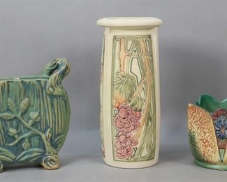        253	3 Pieces Weller Pottery Vases & Planter	3 pieces Weller pottery. Warwick form vase with 2 twig handles, green matte glaze, unsigned, 7 1/2"H; Roma pattern vase, impressed Weller mark, 10"H; Patra pattern square planter, Weller Pottery mark, 4 1/2"W x 4 1/2"H. Crazing to all, flake to one foot of Warwick vase, scratches and discoloration to interior of Patra planter.
