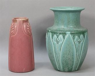        254	2 Rookwood Pottery Production Vases	2 Rookwood Pottery production vases. Form 2136, pink matte glaze and stylized feather decoration, XIX (1919) date mark, 6 3/8"H; form 2413, green speckled matte glaze and stylized tulip decoration, XXXIV (1934) date mark, 7 1/2"H. Both with RP with flames marks to the underside. Some crazing to pink vase, minor discoloration to rim.
