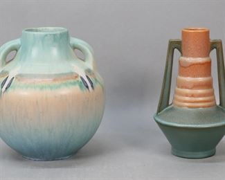        258	Roseville Futura Telescopic Vase & Montacello Vase	2 Roseville pottery vases. Futura pattern telescopic urn, unsigned, with evidence of paper label on underside, 7 1/4"H; Monticello pattern 2 handled vase, unsigned, 7 1/4"H. Futura vase chips to underside, Monticello vase scratches and scuff marks to body.

