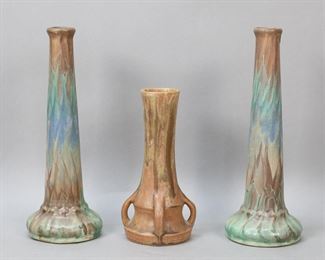        263	3 Art Pottery Vases Zane Pottery	3 art pottery vases. Pair of Zane Pottery (Peters & Reed) Chromal matte glazed vases, both with ZPCO marks to the underside, taller 10 1/8"H; unsigned 4 handled art pottery vase, 7 1/8"H. Glaze imperfection to the rim of one Zane vase.
