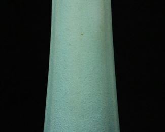        265	Van Briggle Pottery Vase Mistletoe	Van Briggle pottery tapered vase. Green glaze, molded decoration, possibly Mistletoe motif. Partially illegible AA 1917 mark in blue on the underside. 10 3/4"H. Glaze miss to base.
