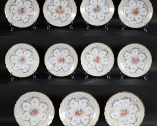        275	Set of 11 Hand Painted Dresden Porcelain Plates	Set of 11 hand painted German porcelain plates. All with gilt enamel and cherub decoration. All with blue crown Dresden marks and impressed F and 246 to the undersides. Each 9 1/4"-diameter.
