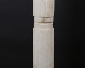        300	Neoclassical Style Marble Sculpture Plinth	"Neoclassical style marble sculpture plinth or pedestal. White fluted Doric column form pedestal with brass fittings on top edge of capital and above base. Scratches, loss, and repair to top of pedestal. Chips and loss to marble on center band of column. Small scuffs and fleabites to marble on base. Residue and wear to banded section of marble below capital. Brass fitting on top of capital is loose. 

43 5/8"" H x 11"" diameter of top.  83 lbs."
