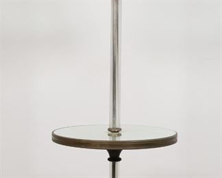        308	Hollywood Regency Style Table Floor Lamp	"Hollywood Regency style table floor lamp in the manner of Maison Jansen. 20th century. White linen shade, inner milk glass shade, crystal rod extending through tier, ending in mirrored base with brass feet. Chips, scuffs, and desilvering to mirrored base. Scratches, scuffs and marks to mirrored tier. Scuffs and spot stains throughout surface of crystal rod. Pilling and fraying to linen shade. Untested.

60 1/2"" H x 16"" diameter of tier"
