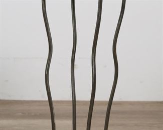        309	Hollywood Regency Style Metal and Glass Side Table	"Hollywood Regency style side table or plant stand. 20th century. Glass top with ruffled form emulating table cloth on top of metal stand with serration form edges. No maker's marks or labels present. Scuffs and wear to glass top. Small fleabite to edge of glass top.  Tarnishing and wear throughout metal of stand. 

26 3/4"" H x 16 3/8"" diameter of glass top. 18 lbs. 
"
