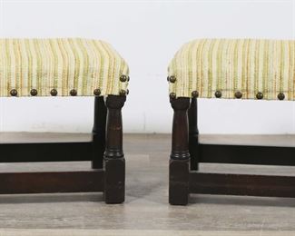        313	Pair of Upholstered Nailhead Trim Footstools	"Pair of upholstered nailhead trim footstools. 20th century. Turned legs, nailhead trim, striped upholstery. Scratches, pitting, scuffs, and wear to wood throughout legs and stretchers of both stools. Pilling, fraying and wear throughout upholstery of both stools. Repairs to stretcher and legs of one footstool.

18 1/2"" W x 14 1/2"" D x 16"" H."

