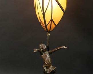        325	JMR The Good Fairy Lamp With Mica Shade	Josephine Kern for Jessie McCutcheon Raleigh "The Good Fairy" patinated white metal sculpture, mounted as a lamp, with art deco mica "leaf" shade. Sculpture marked on the base JMR 1916. 28 3/8"H. Oxidation, discoloration and scratches to lamp base and lamp fitting, losses to brass patina on shade, pin to open shade bent and replaced.
